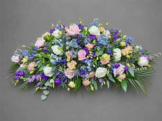 4ft Natural Textured Casket Spray — Seasonal flowers to include roses, lisianthus, delphinium, gentians, agapanthus, alstroemeria, thist