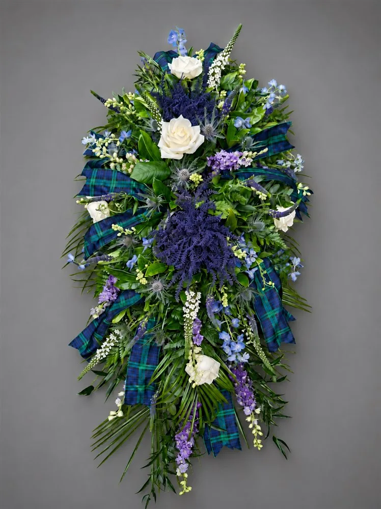 Scottish Themed Casket Spray — Scottish themed casket spray in Blues and purples, including thistle, Veronica, lisianthus, delphini