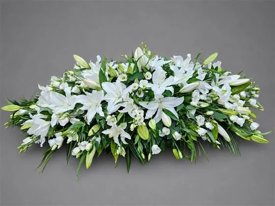 White Oriental Lily Casket Spray — A beautiful White lily casket spray, with complementary White Lisianthus, white antirrhinum and whit