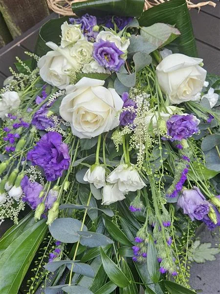 White & Purple Tied Sheaf Spray — A tied sheaf of white roses and purple lisianthus with delicate white sprays, small purple flowers a