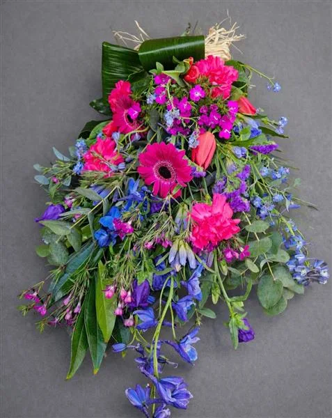 Blue & Purple Tied Sheaf — Mixed seasonal blue and purple flowers made into a simple tied sheaf arrangement At checkout, please