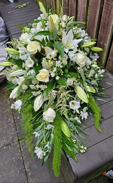 Classic White Single Ended Spray — A single-ended spray in classic whites and greens, with white roses and lilies, soft white sprays an