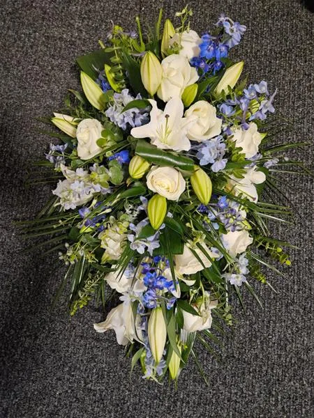 Modern Serenity Teardrop Oasis Arrangement — Modern elegance meets heartfelt simplicity in this serene teardrop spray. The crisp whites of Avalan