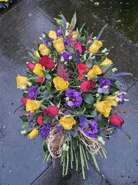 Vibrant Single Ended Spray — A rainbow of colour makes this single ended spray eye catching and helps celebrate a loved one's per