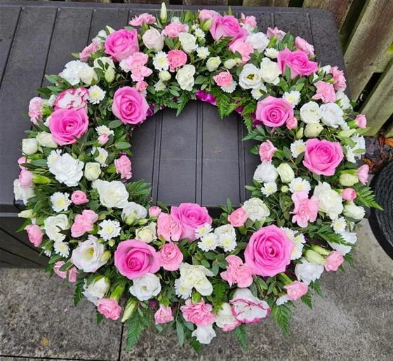 Pinks Seasonal Mix Funeral Wreath — Mixed flower wreaths available in any colour of your choosing and different sizes. At checkout, plea