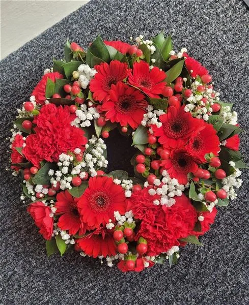 Red Seasonal Funeral Wreath — Mixed flower wreaths also available in any colour of your choosing and different sizes. Our picture 