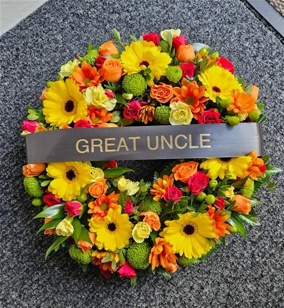 Mixed Seasonal Funeral Wreaths — Mixed flower wreaths available in any colour of your choosing and different sizes. At checkout, plea