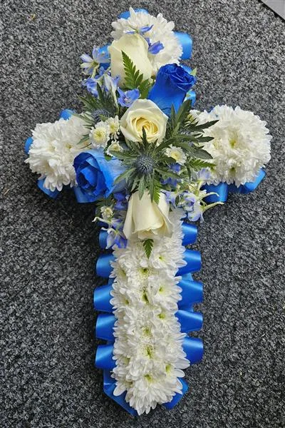 Blue & White Based Cross — Blue and White cross tribute, based in white chrysanthemums, with a blue ribbon edging, finished wit