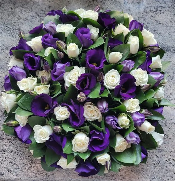 Purple & White Posy Arrangement — This arrangement consists of roses, purple lisianthus and foliage, finished with a complementary rib