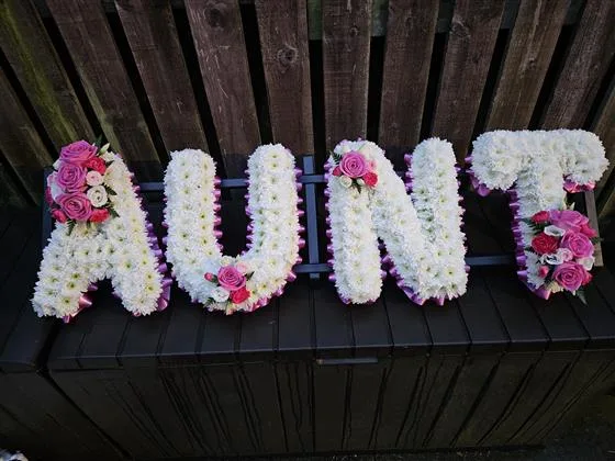 4 Letters Funeral Tribute — Funeral letters Based in white double Chrysanthemums with either a foliage or ribbon edge in a colou