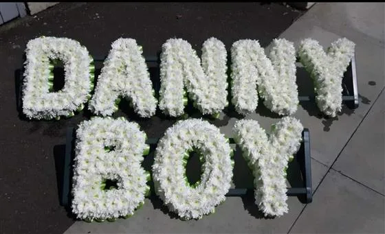8 Letter Funeral Tribute — Funeral letters Based in white double Chrysanthemums with either a foliage or ribbon edge in a colou