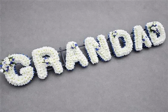 7 Letters Funeral Tribute — Funeral letters Based in white double Chrysanthemums with either a foliage or ribbon edge in a colou