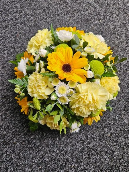 Yellow & White Memorial Posy Arrangement — A round posy in yellow and white, with a yellow gerbera at the centre surrounded by lemon carnations