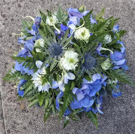 Blue Posy — 10" round posy made up of a mixture of all blue flowers, ideal for a baby's grave or a memorial plot