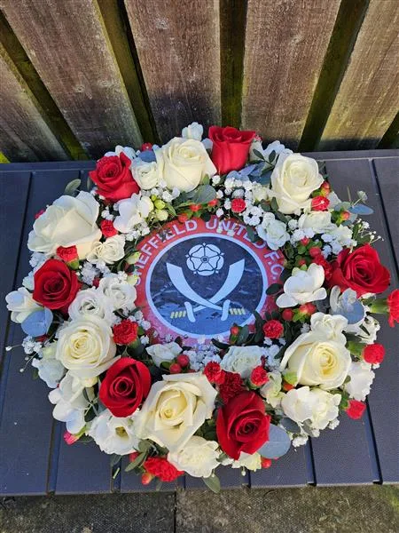 SUFC Football Wreath — These football flowers are available in various team colours of your choosing. A ribbon can be attac