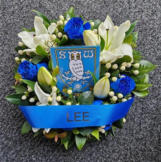 Football Lily Wreath — Sheffield Wednesday Floral Wreath made with blue roses, white oriental lily and mixed seasonal flowe