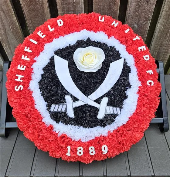 SUFC Badge - Artificial — 16" SUFC Badge made in artificial flowers, a fitting tribute for any blades fan. A name ribbon sash