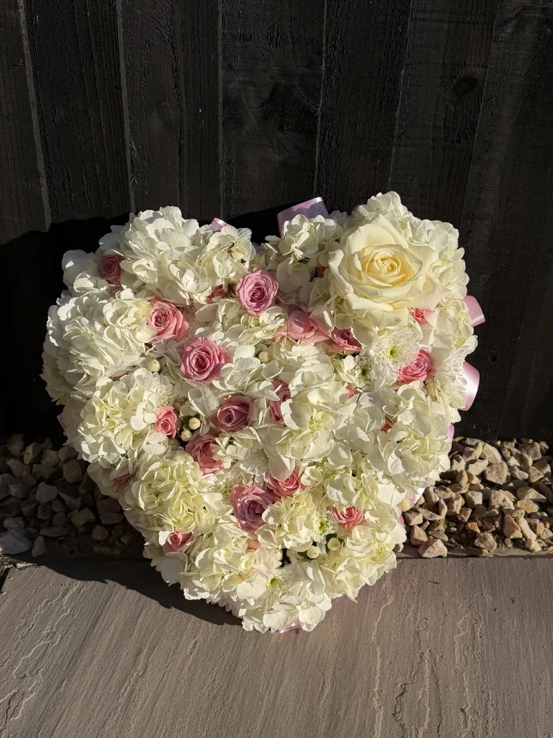 The Luxury Floral Heart Tribute — An exquisite expression of love and remembrance. This luxurious, full floral heart combines romantic