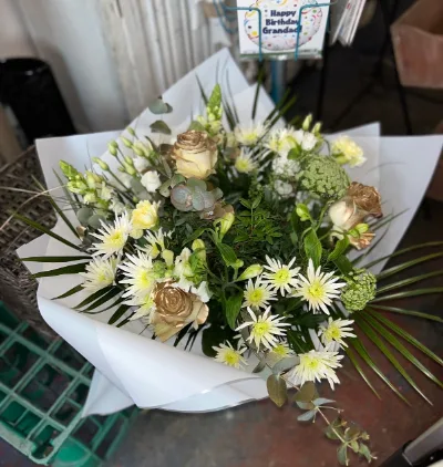 The White Garden — Creamy whites and soft greens with chrysanthemums, lisianthus and eucalyptus.