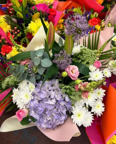 The Grand Garden — A generous mix of hydrangea, alliums, roses, lilies and chrysanthemums.