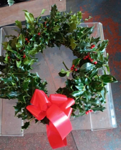 The Holly Ring — A classic ring of fresh holly, finished with a red bow.