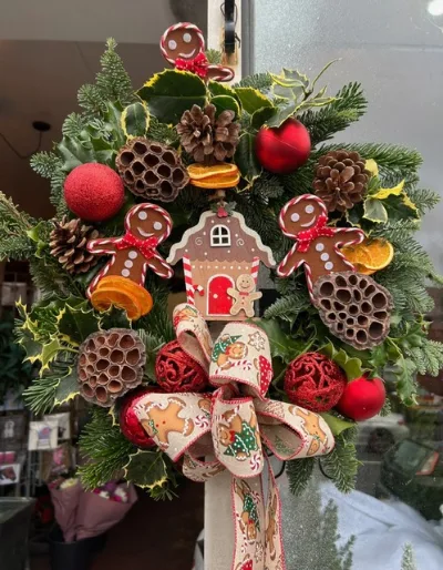 The Gingerbread — Fresh festive foliage with a gingerbread house, gingerbread men, red baubles, dried orange and lotus