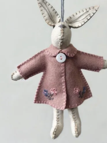 Felt Rabbit Hanger — A handmade felt rabbit hanger in a little coat. Available in two sizes.