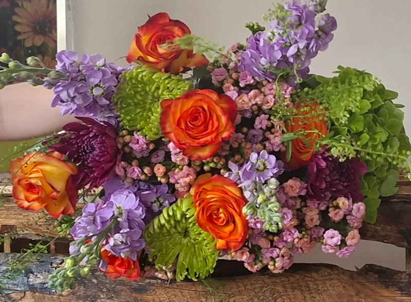 Florist Choice — Bright seasonal mix, exact blooms will vary producing a unique fresh floral handtie bouquet every ti